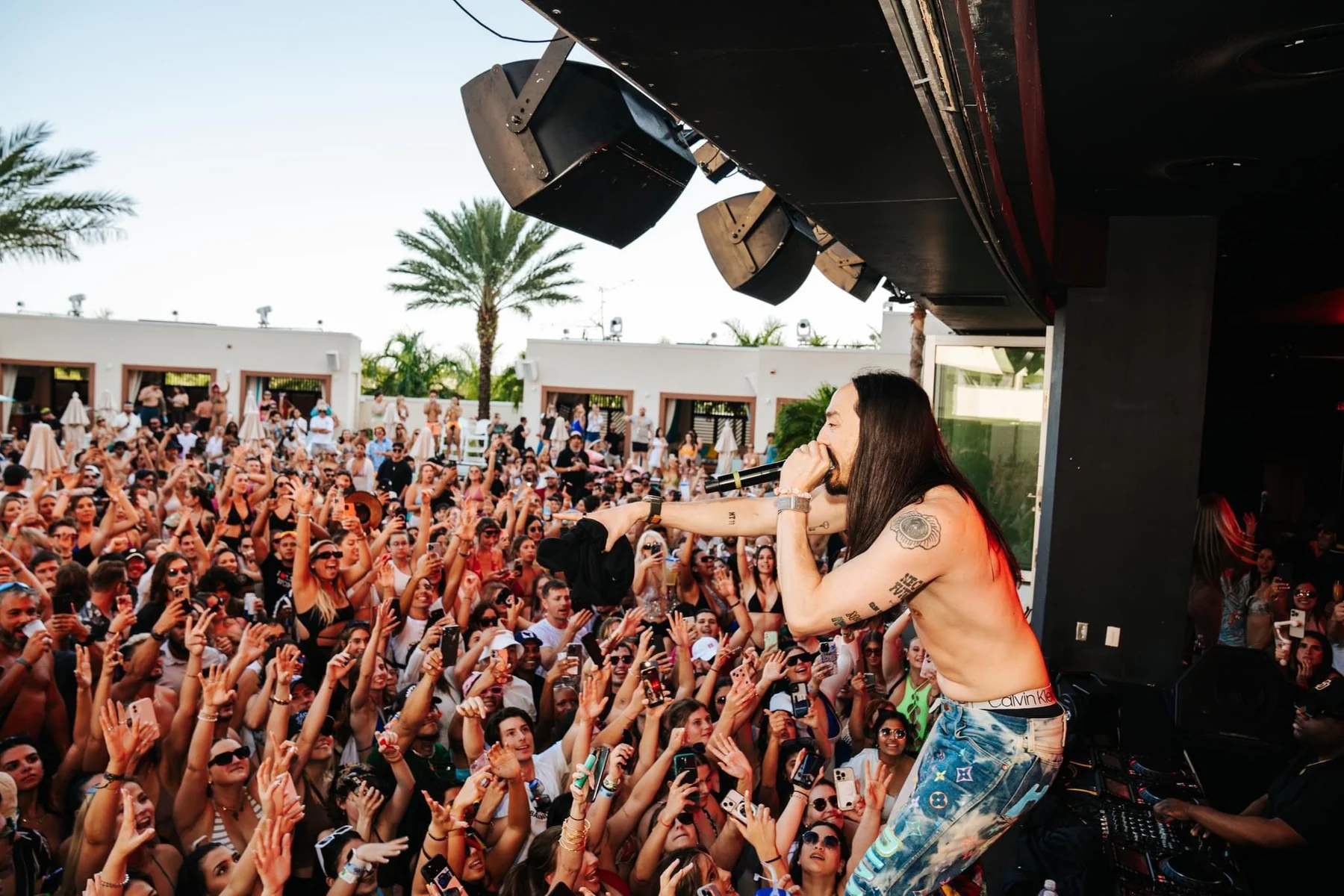 Headline DJ performing to a packed crowd at DAER Nightclub
